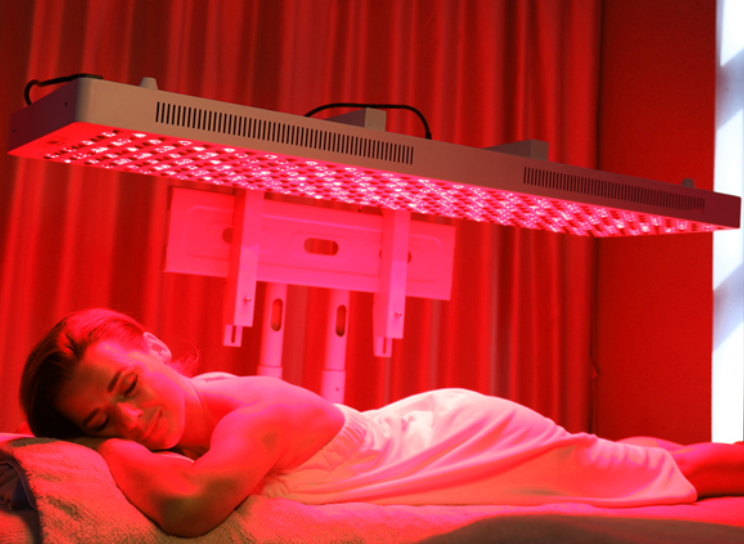 Woman in a red light therapy session.