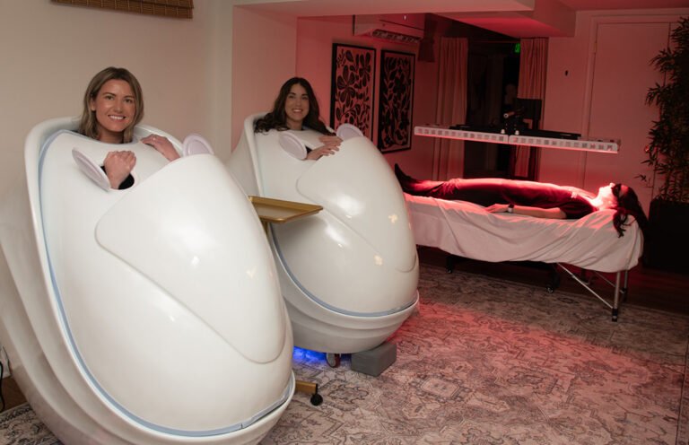 Women using wellness pods and red light therapy