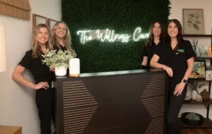 Four staff at wellness clinic reception desk