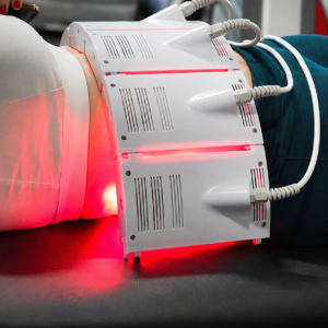 Red light therapy device on abdomen